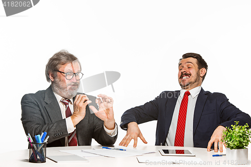 Image of The two colleagues working together at office on white background.