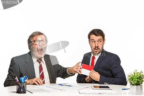 Image of Concept - corruption. Businessman in a suit taking a bribe