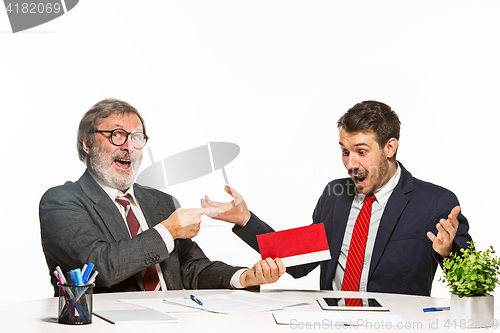 Image of Concept - corruption. Businessman in a suit taking a bribe