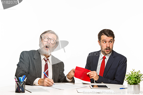 Image of Concept - corruption. Businessman in a suit taking a bribe