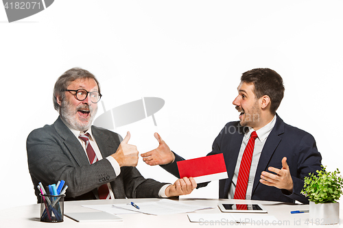 Image of Concept - corruption. Businessman in a suit taking a bribe