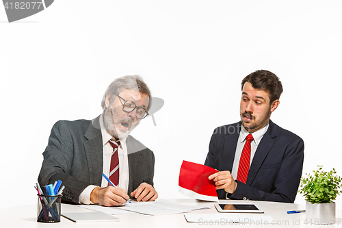 Image of Concept - corruption. Businessman in a suit taking a bribe