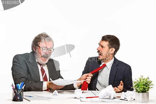 Image of Concept - corruption. Businessman in a suit taking a bribe