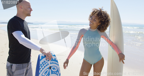 Image of Cheerful people talking on beach