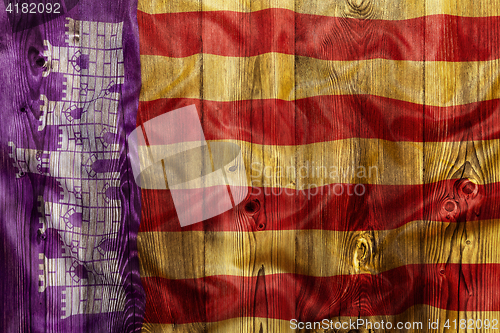 Image of National flag of Mallorca, wooden background