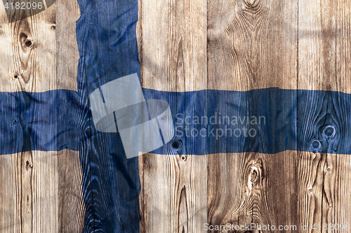 Image of National flag of Finland, wooden background
