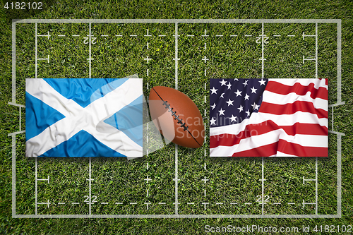 Image of Scotland vs. USA\r flags on rugby field