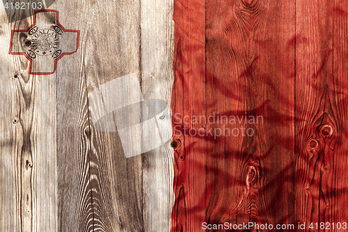 Image of National flag of Malta, wooden background