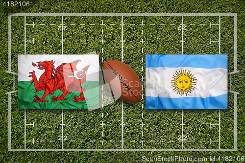 Image of Wales vs. Argentina flags on rugby field