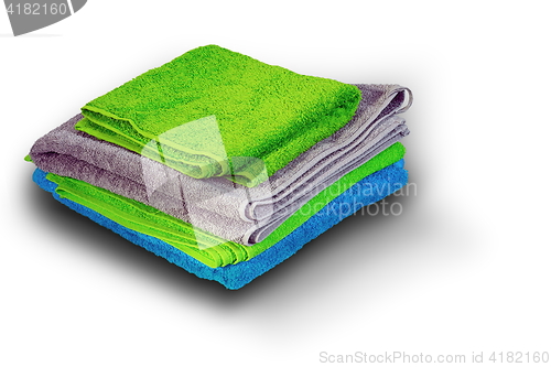 Image of pile of colorful towel on white