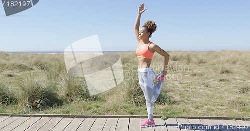 Image of Woman stretching a leg