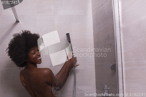 Image of African American woman in the shower