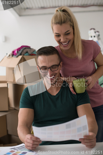 Image of Young couple moving in a new home