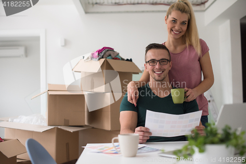 Image of Young couple moving in a new home