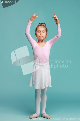 Image of The little balerina dancer on blue background