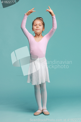 Image of The little balerina dancer on blue background