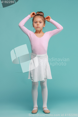 Image of The little balerina dancer on blue background