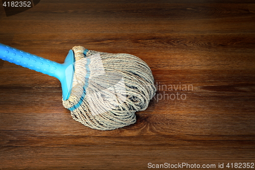 Image of closeup of mop on the floor