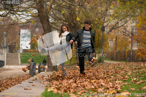 Image of Happy young Couple in Autumn Park