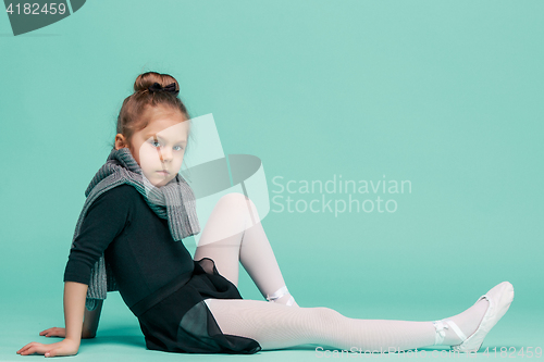 Image of The little balerina dancer on blue background