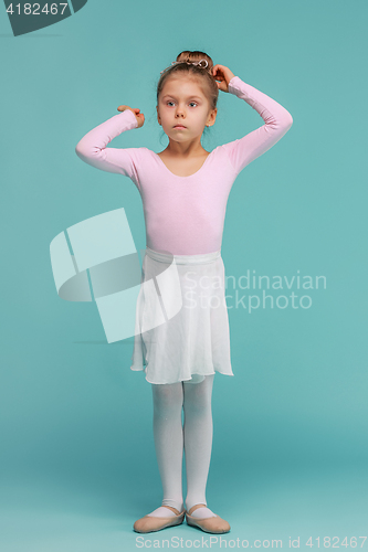 Image of The little balerina dancer on blue background