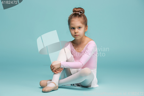 Image of The little balerina dancer on blue background