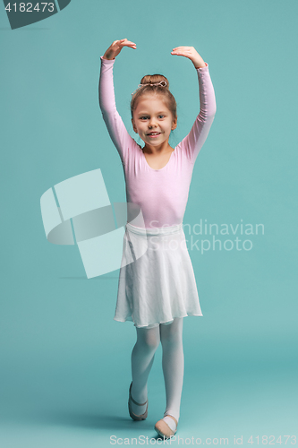 Image of The little balerina dancer on blue background