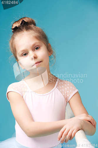 Image of The little balerina dancer on blue background