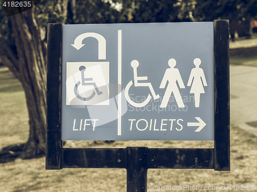 Image of Vintage looking Lift and toilets sign