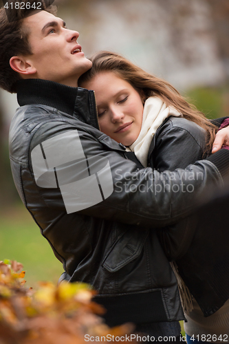 Image of Autumn portrait of attractive happy couple