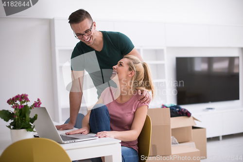 Image of Young couple moving in a new home