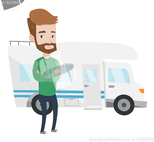 Image of Man standing in front of motor home.