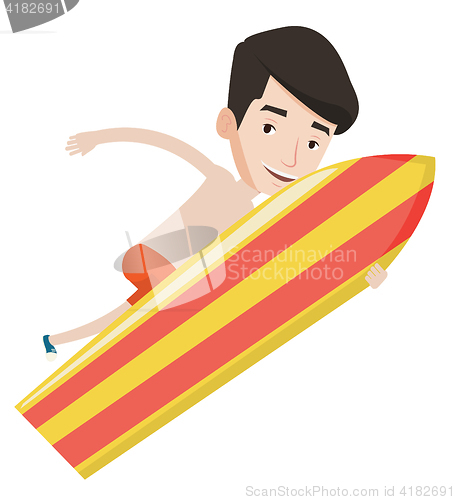 Image of Happy surfer in action on a surf board.