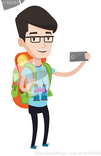 Image of Man with backpack making selfie.