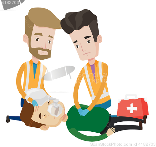 Image of Emergency doctors carrying man on stretcher.