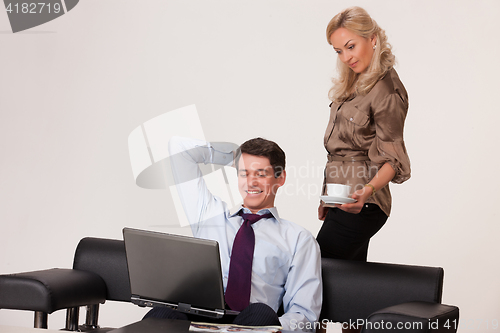 Image of Young Woman And Man with a notebook