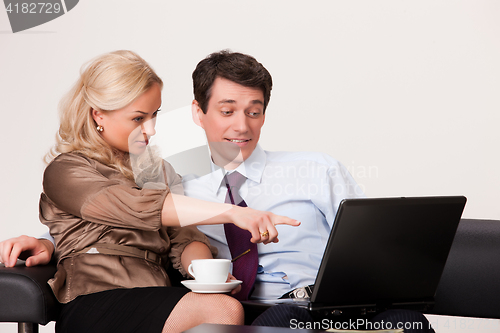 Image of Young Woman And Man with a notebook