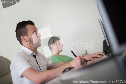 Image of a group of graphic designers at work