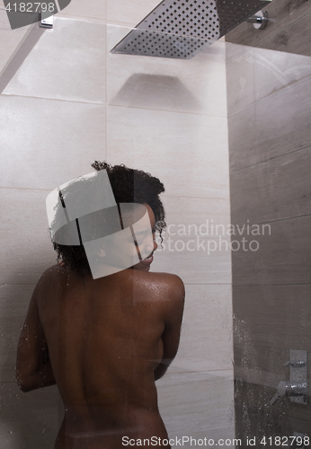 Image of African American woman in the shower