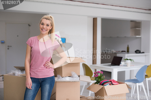 Image of girl moving in the new apartment