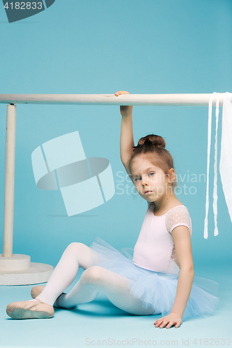 Image of The little balerina dancer on blue background