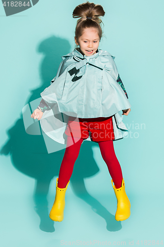 Image of Little girl posing in fashion style wearing autumn clothing.