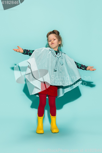 Image of Little girl posing in fashion style wearing autumn clothing.