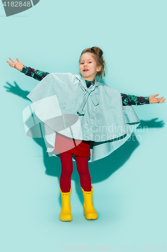 Image of Little girl posing in fashion style wearing autumn clothing.