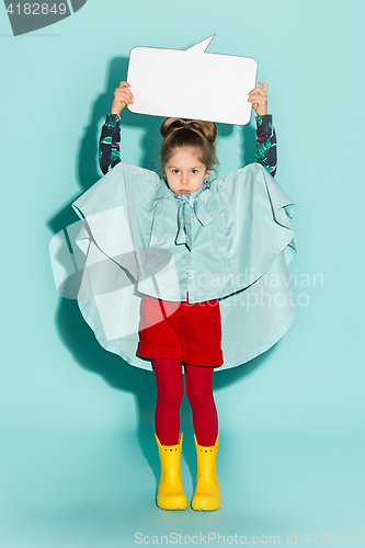 Image of Little girl posing in fashion style wearing autumn clothing.