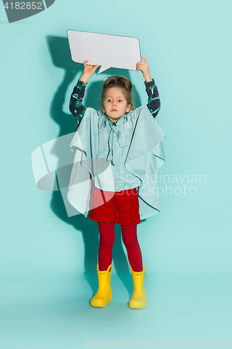 Image of Little girl posing in fashion style wearing autumn clothing.