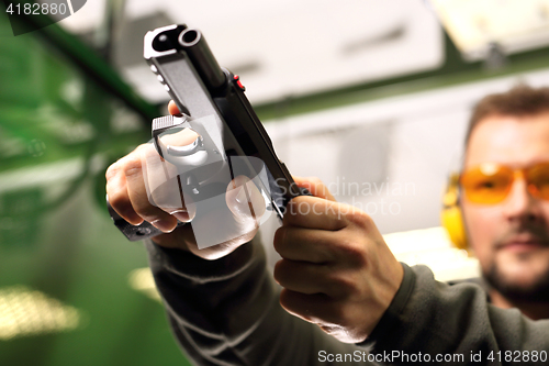 Image of Sport shooting range. The man at the shooting range.