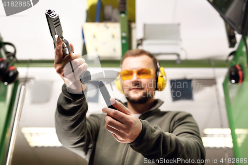 Image of Gun. Sport shooting range.