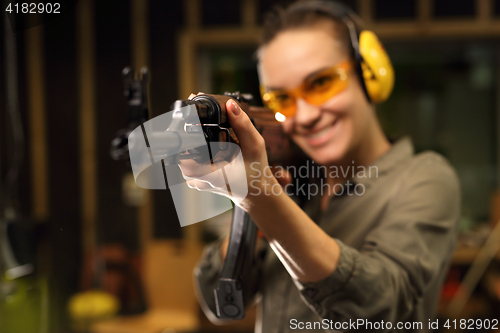 Image of The woman at the shooting range.