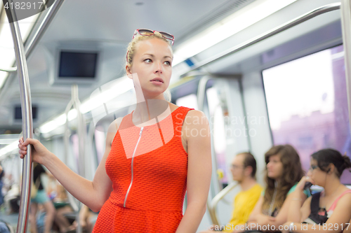 Image of Lady traveling by metro.